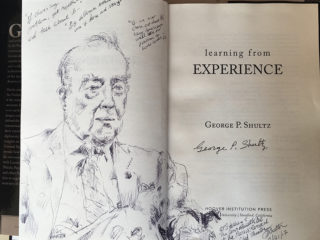 George Shultz<br>Pen sketch in book